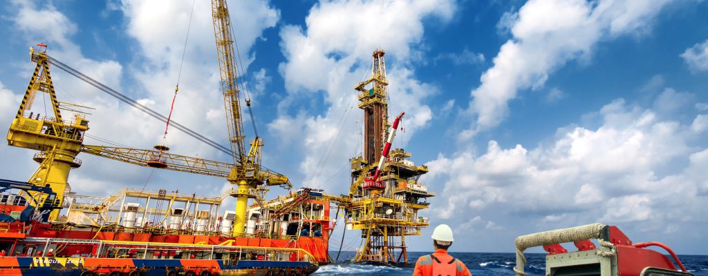 echnician or worker on the crew boat during transfer to platform or drilling rig  in process oil and gas platform offshore,technician